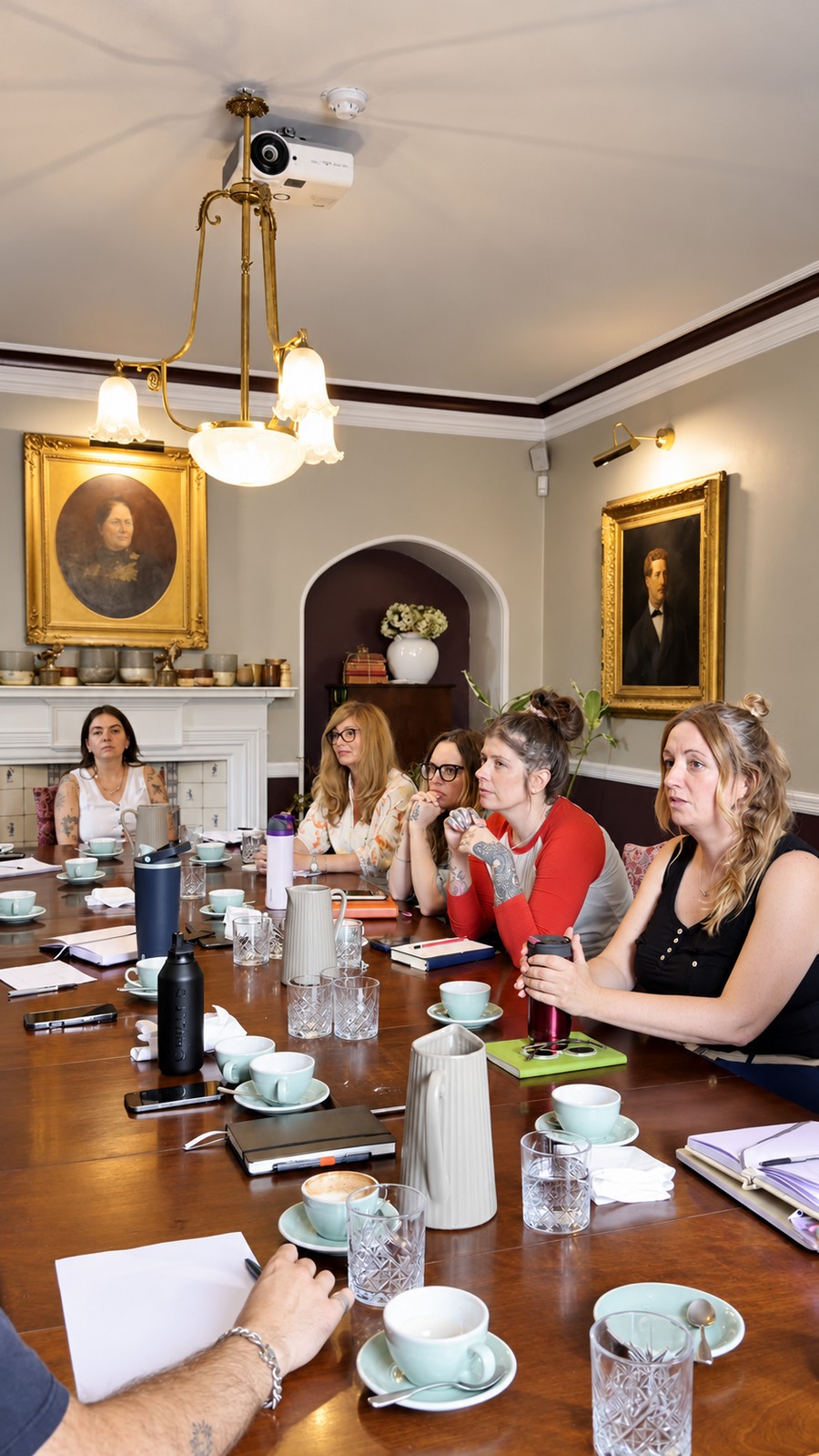 Members discussing their wedding businesses around the table